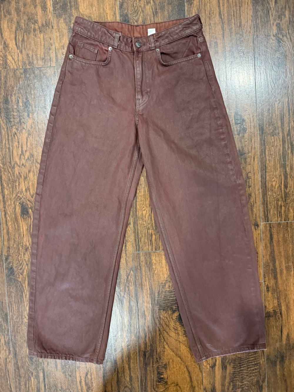 Waxed Coated, Rich Burgundy Denim with a Subtle Leather-inspired Sheen